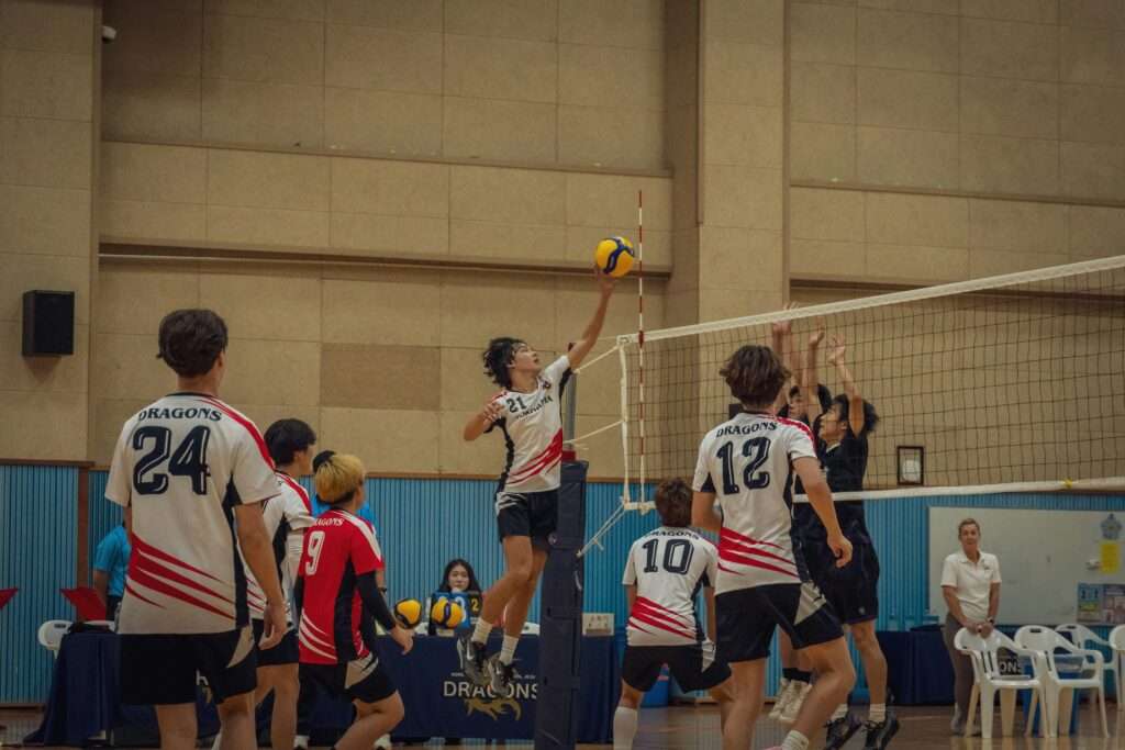 Men's Volleyball players playing.