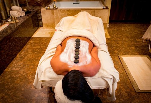 Woman receiving hot stone massage